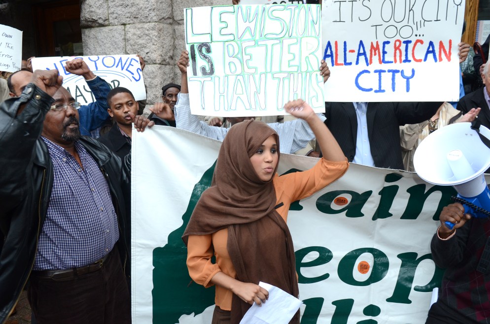 Nimo Yonis of Lewiston leads a chant with about 40 others in front of City Hall in Lewiston on Thursday October 4th, 2012 . It was organized by Maine People's Alliance, who delivered a petition asking for Lewiston Mayor Robert Macdonald to apologize to the community and step down from office.